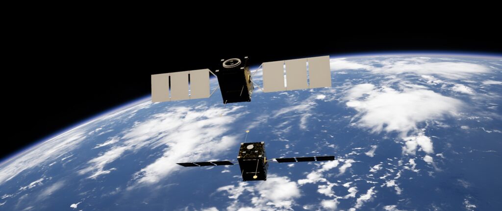 Imagem em cores de dois satélites na órbita terrestre.