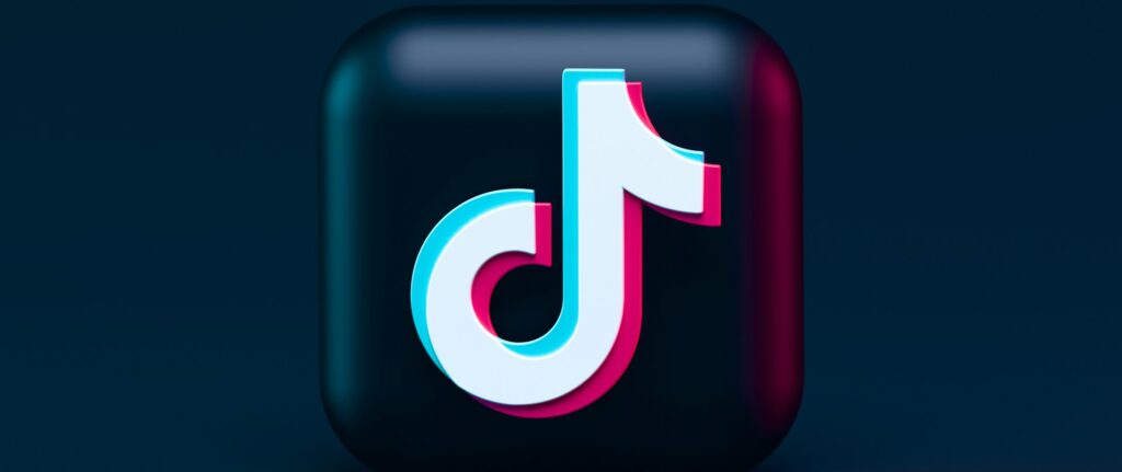 Ícone do app Tik Tok sob fundo azul-escuro.